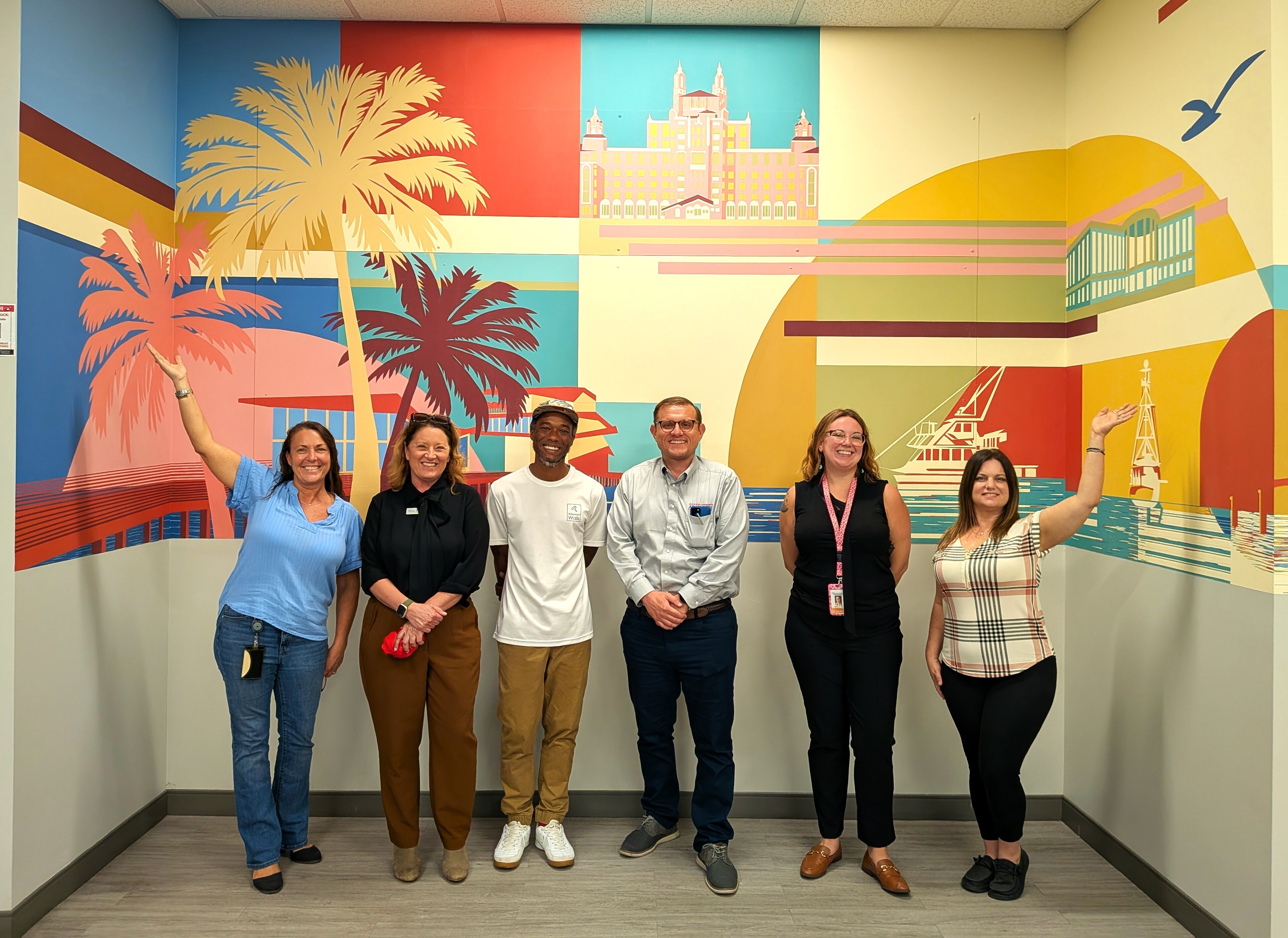 Tax Collector Adam Ross and muralist Jason Harvin pictured with tax collector and Creative Pinellas staff